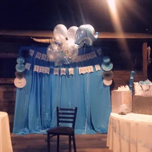 a table with balloons and presents