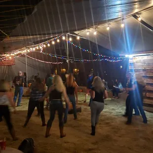 people dancing in a barn