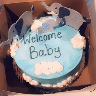 a welcome baby cake in a box