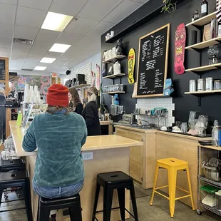 a woman sitting at a counter