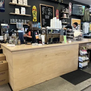 a man working at a coffee shop