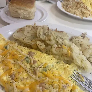 Western omelet, home fries and homemade biscuit