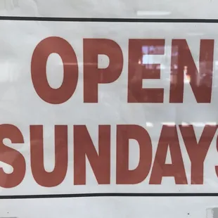 an open sunday sign