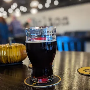 a glass of beer on a table