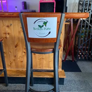 a broken plate on a bar stool