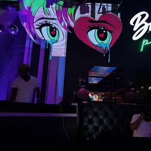 a neon sign with a woman's eyes