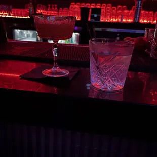 a glass of water on a bar counter