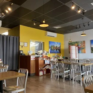 a restaurant with tables and chairs