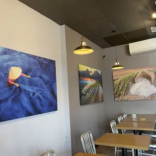 Delicious lemon grass chicken and pho!  Great prices,  beautiful art, give it a try!