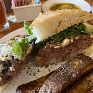Bleu burger on focaccia with Jo Jo potatoes.