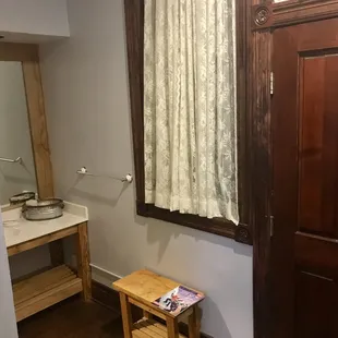This was the inside of the room by the bathroom . Very clean and comfy room complete with a refrigerator and microwave.