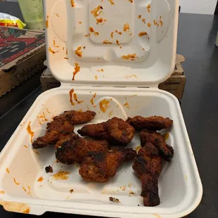 chicken wings in a styrofoam container
