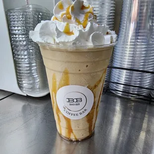 an iced coffee with whipped cream and caramel