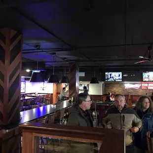 a group of people at a bar