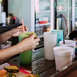 a man sitting at a bar drinking a drink