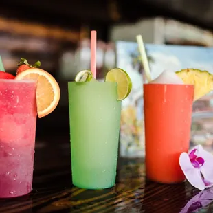 three different colored drinks