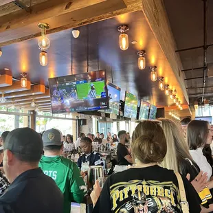 a crowd of people at a bar