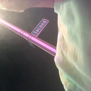 a person holding a street sign