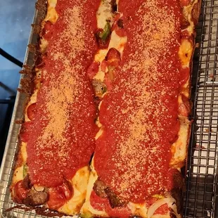 This one Asigo, fresh Mozzarella blend , Pepperoni ( not greasy at all ) thin slice Sausage,  diced Onions, Peppers , tomato marinara .