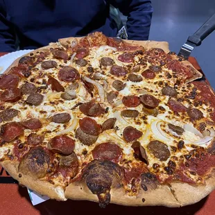 This is the large pepperoni added sausage and onion. Notice the sausage is cut coins from links and not crumbles!