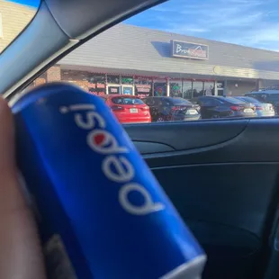 a can of pepsi in a car