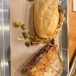 King of Queens pastrami sandwich, and the Baja chicken sandwich made spicy