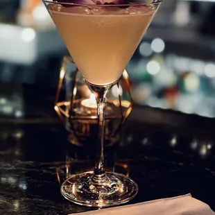 a cocktail in a martini glass
