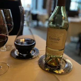 a glass of wine and a bottle of wine