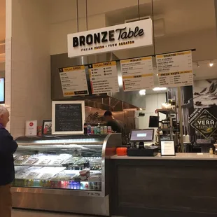 a man standing in front of a counter