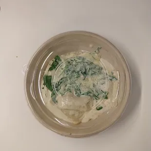 Wild mushroom &amp; sage ravioli in a takeout container. (All food is take-out; they don't plate for eat-in.)