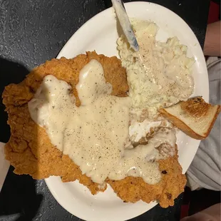 Chicken fried steak, mashed potatoes and gravy. These plates are huge and the food didn't fit on it. You won't go away hungry!!