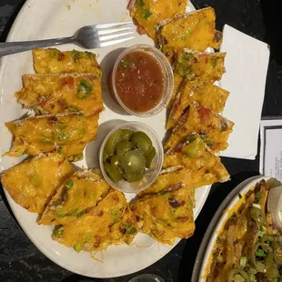 Chicken nachos. Came with sour cream, but I'd recommend ranch. I'm not a ranch or sour cream person but their ranch was amazing with these!