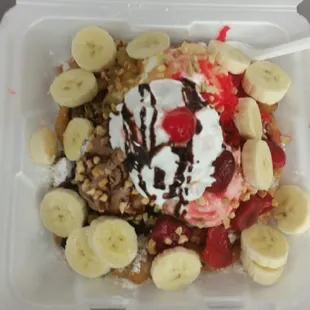 HOME MADE FUNNEL CAKES COOKED ON DEMAND TOPPED WITH BANANNA SPLIT.