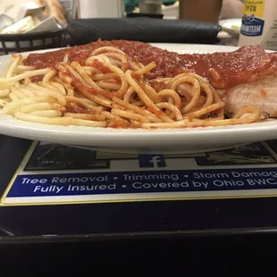 a plate of spaghetti and meat