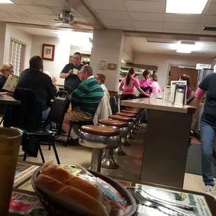 people sitting at tables eating