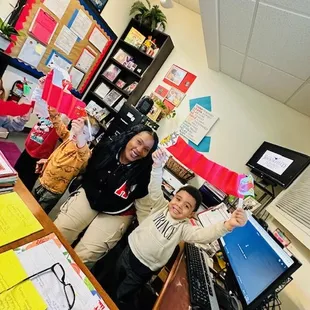 My friends dropping by the Director's office to show off their Dragons for Lunar New Year Dragons.