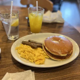a breakfast of pancakes, eggs, sausage, and pancakes