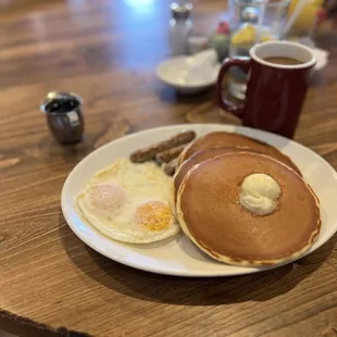 a plate of pancakes and eggs