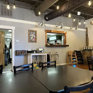 a dining area with tables and chairs