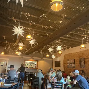 people sitting at tables in a restaurant