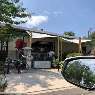 a bicycle parked in front of a restaurant