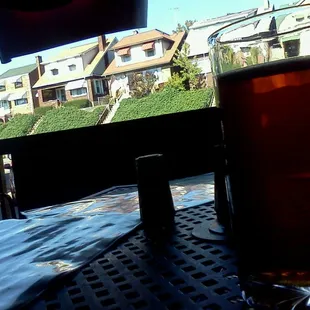 a pint of beer on a patio table