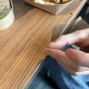 This is the plastic found in the bagel. Thought it was a hair originally like my sandwhich but no, just plastic