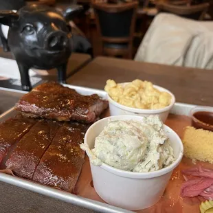 1/2 rack ribs with potato salad and mac and cheese