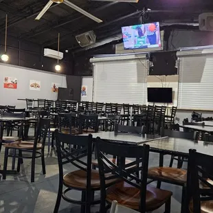 tables and chairs in a sports restaurant