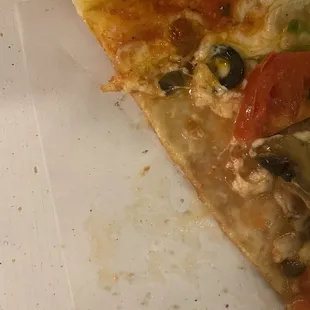 a half eaten slice of pizza