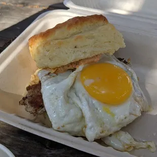 Buttermilk biscuit sandwich with fennel sausage, pimento cheese, and dill pickles