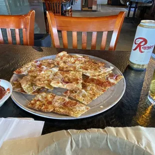 a plate of pizza and a glass of beer