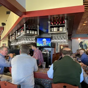 a group of people sitting at a bar