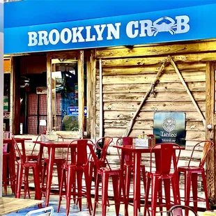 red chairs and tables outside a restaurant